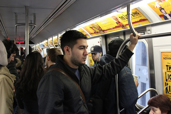 Ulysses Hernandez, a student at The New York Institute of Technology, rides the train from his home in Bushwick to school.