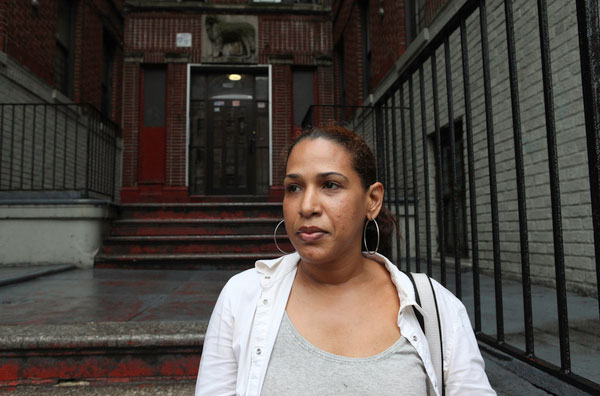 Cinthia Caimares, who has lived at 2500 University Avenue -- a Milbank property -- for about 2 years, is a student at Bronx Community College and works at Yankee Stadium on the weekends. She is afraid of being forced to move out and does not understand who owns the building.