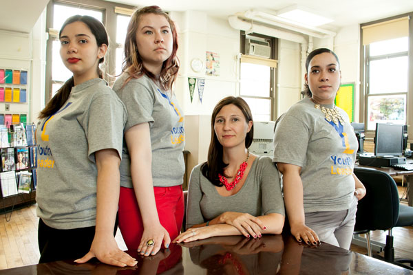 at the High School of Fashion Industries in Manhattan, college readiness is not only the focus of Kate McKeon, seated, the college counselor, but also Youth Leaders (standing, from left to right) Alondra Rivera, Gabriella Ramalho and Maria Santana.