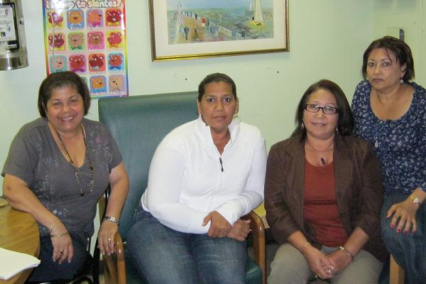 (From L to R) Celeste Garcia, Arelis Melo, Maria Contreras and Juana Hidalgo, workers at La Familia Unida day care center, in their staff room in Washington Heights.