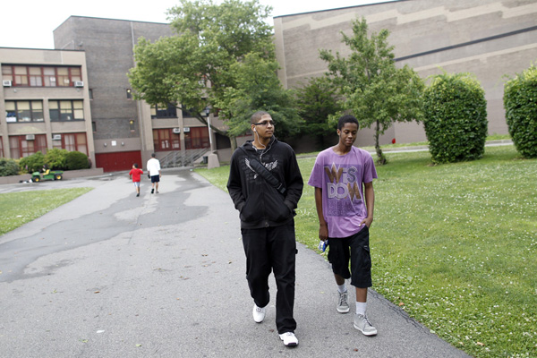 Junior Jeremy Lock, 18 (dressed in black) and freshman Patrick Green, 16, leaving Dewey High School in Brooklyn on Friday, June 22. Greene, who studies audiovisuals, produced a video called <a href=