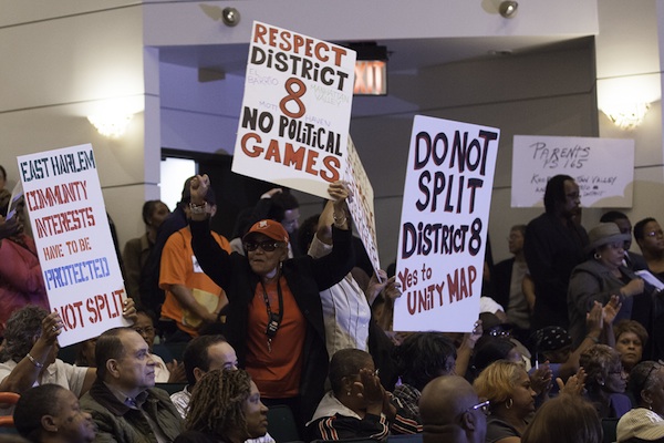 Protesters at an October hearing on proposed changes to City Council districts voice their concerns over redrawn lines for the East Harlem district represented by Melissa Mark-Viverito. A revised proposal is now under consideration.