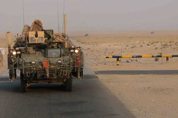 An Army unit crosses from Iraq into Kuwait on August 15 as part of the draw-down that has removed combat units but left some 50,000 U.S. servicemembers in Iraq.