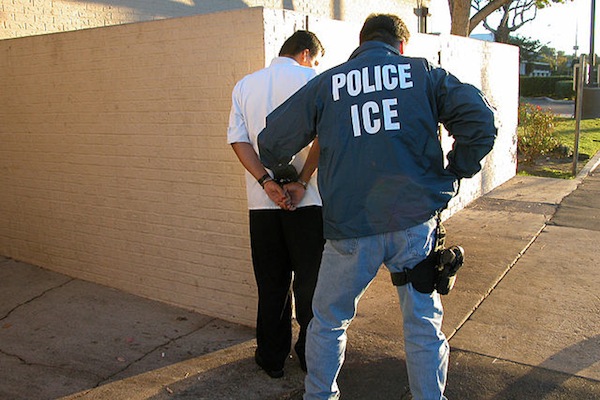An ICE agent making an arrest.