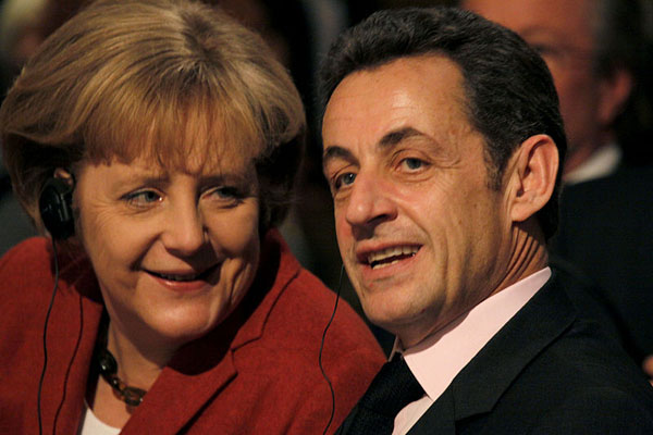 German Chancellor Angela Merkel and French President Nicolas Sarkozy probably aren't thinking about New York City's budget as they try to save the Euro, but a new report indicates the city will feel the effects if they fail.