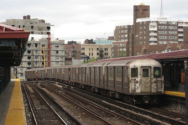 A 4 train pulls into the Bedford Park Avenue station.