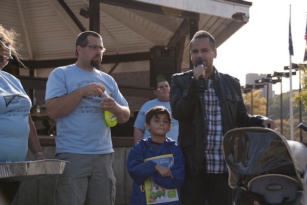 State Sen. Jose Serrano speaks at a recent event with his son at his side.