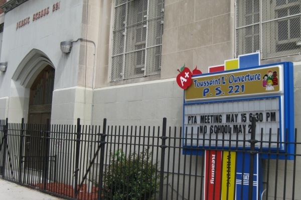 P.S. 221 is a school within district 17 that is being co-located with a new charter school.