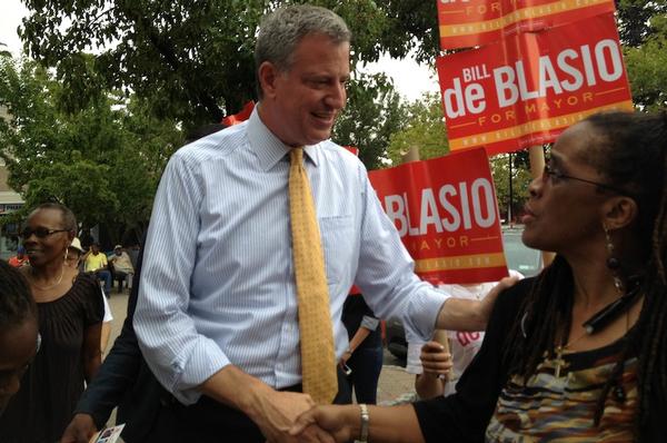 Democratic mayoral candidate Bill de Blasio shakes hands with supporter Gail Badger, assistant general manager of Co-op City's management company, Marion Scott Real Estate.