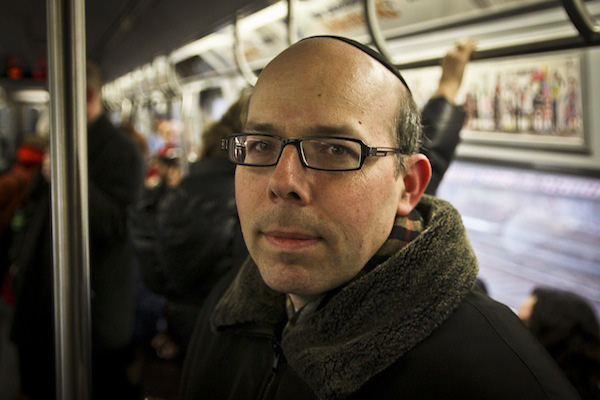 Abe Leitner rides the Q train from Brooklyn into Manhattan on Wednesday morning.