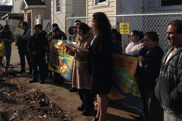 Undocumented immigrants in Staten Island protest a lack of assistance in the wake of superstorm Sandy. Second from right, holding the sign, is Maria Raquel.