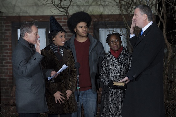 De Blasio is sworn in just after midnight on January 1.
