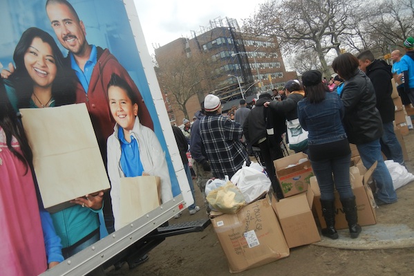 Three days after Sandy, food distribution on the Rockaways. The Assembly notes that a critical food hub at Hunts Point in the Bronx is vulnerable to storm surges, and proposes that a second distribution site be developed to spread the risks.