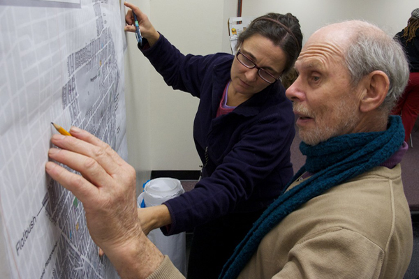 Michael Carder & Susannah Laskaris identify park space on a map at a recent participatory budgeting meeting in Brooklyn's 45th Council district, one of four where a pilot project is under way to allow constituents to decide how some capital funding is spent.